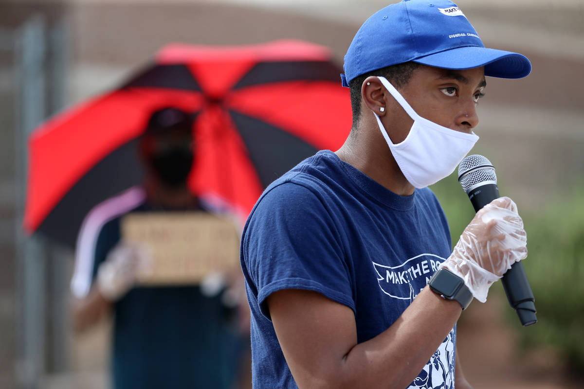 Jordan McRae, who graduated from Mojave High School in 2018, speaks during a protest organized ...