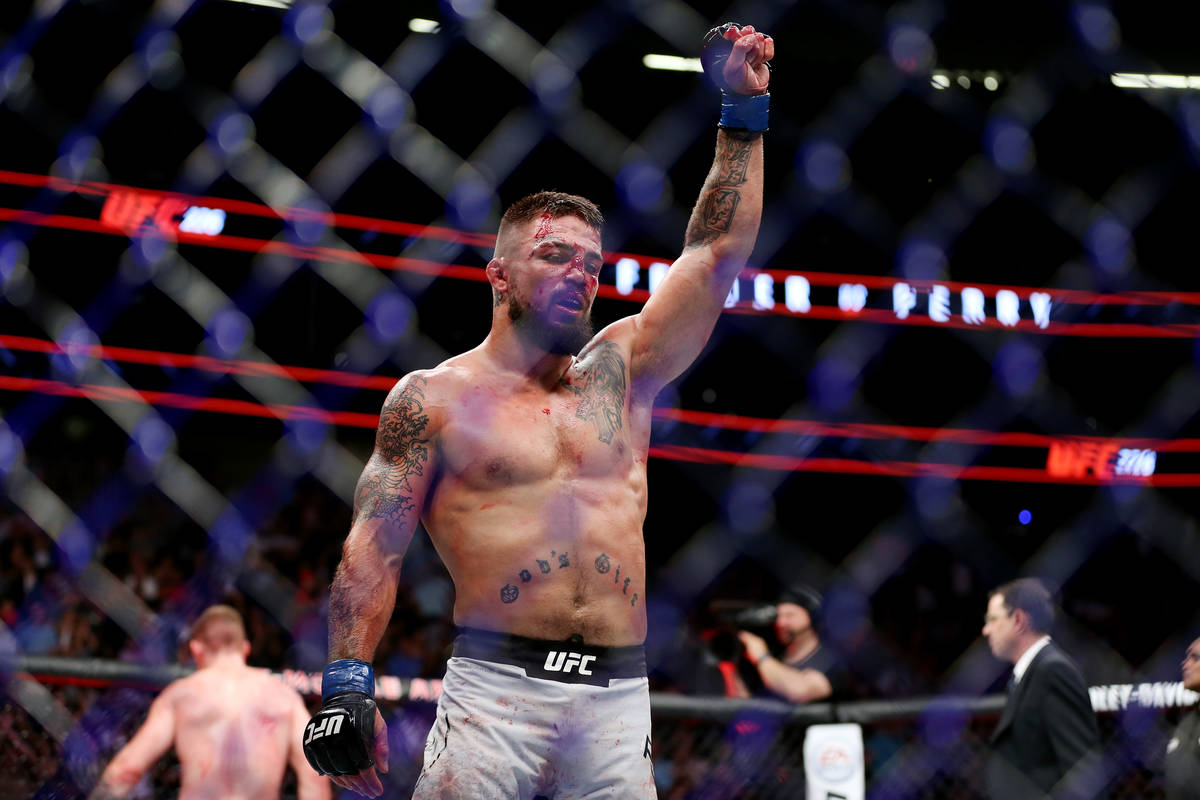 Mike Perry creacts after his fight against Paul Felder in the welterweight bout during UFC 226 ...
