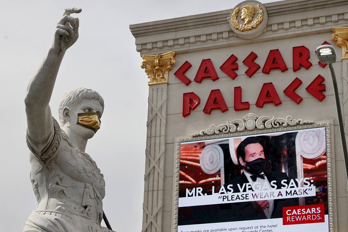 A statue of Julius Caesars dons a mask at Caesars on the Strip in Las Vegas Wednesday, June 24, ...