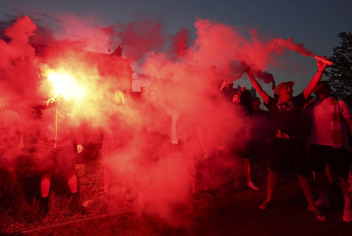 Liverpool supporters celebrates outside Anfield Stadium in Liverpool, England, Thursday, June 2 ...