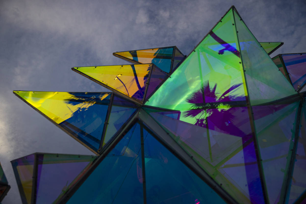Reflections in the sculpture "Pulse Portal" by Davis McCarty at Area 15's Art Island ...