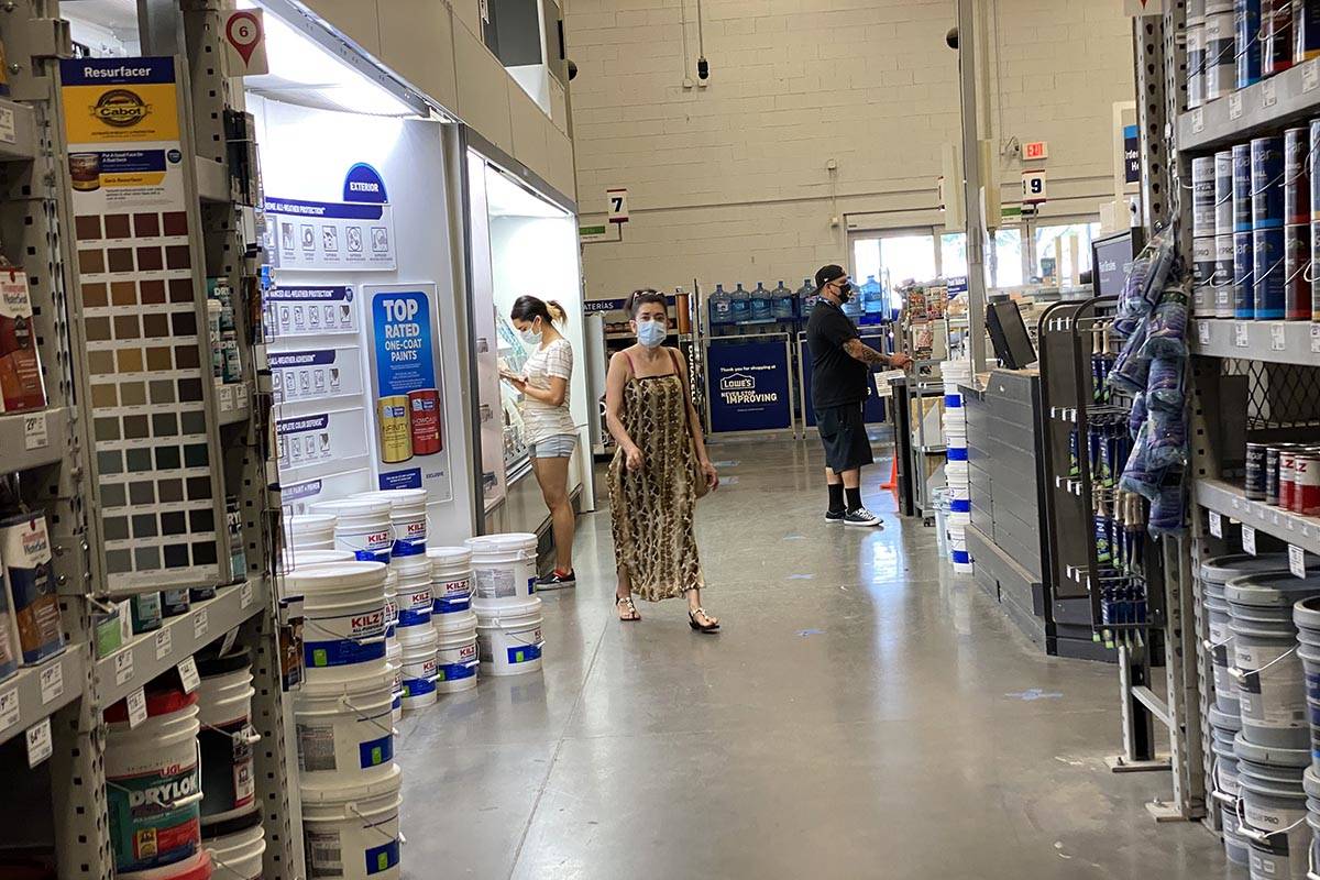 Shoppers don face masks while shopping at Lowe's on East Charleston Boulevard near Fremont Stre ...