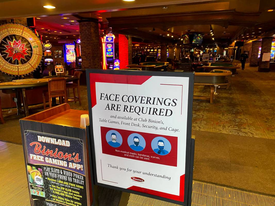 A sign notifying guests of a face covering requirement at Binion's in downtown Las Vegas on Fri ...