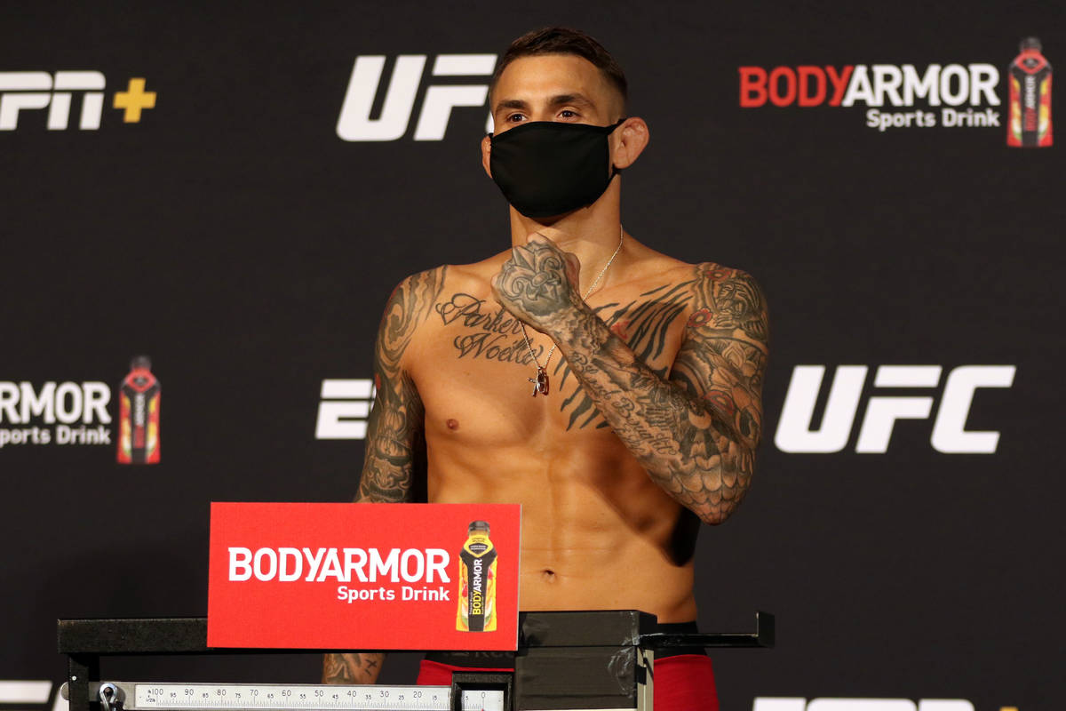 UFC lightweight Dustin Poirier poses on the scale at the UFC Apex during weigh-ins for UFC on E ...