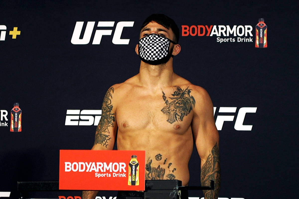 UFC welterweight Mike Perry poses on the scale at the UFC Apex during weigh-ins for UFC on ESPN ...