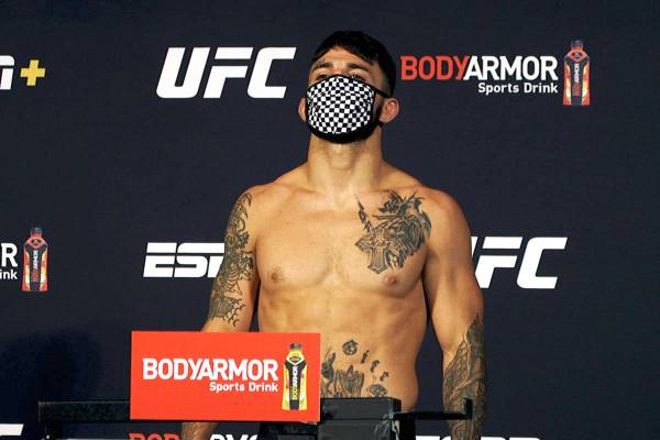 UFC welterweight Mike Perry poses on the scale at the UFC Apex during weigh-ins for UFC on ESPN ...