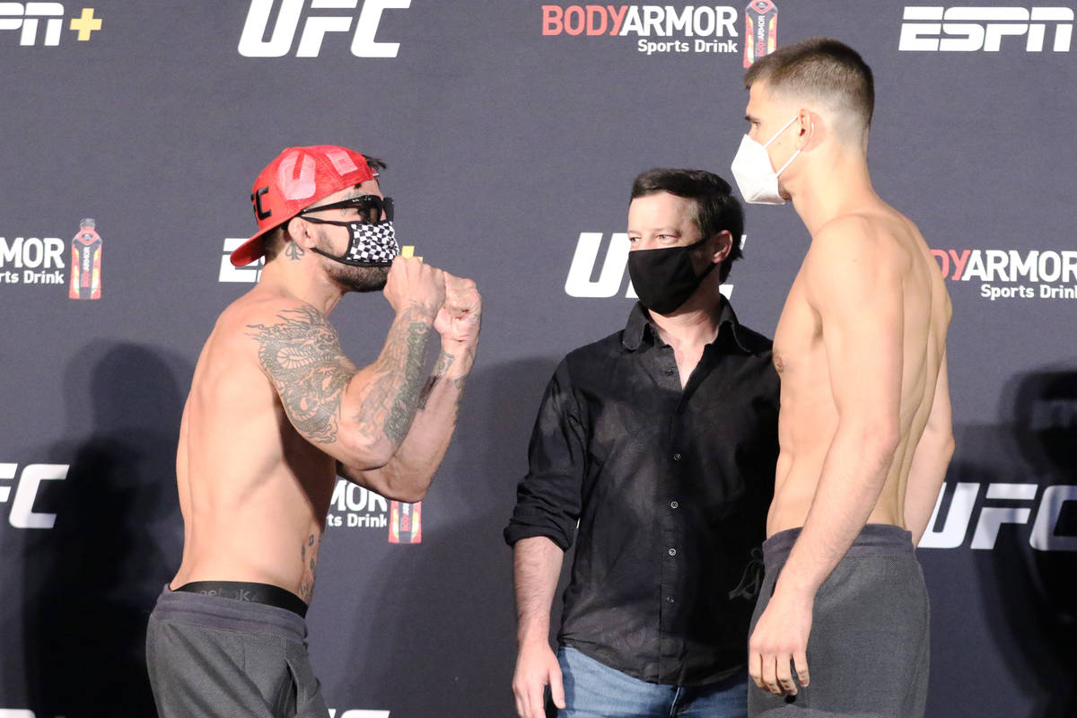 UFC welterweight Mike Perry, left, faces off against his opponent, Mickey Gall, right, as UFC m ...