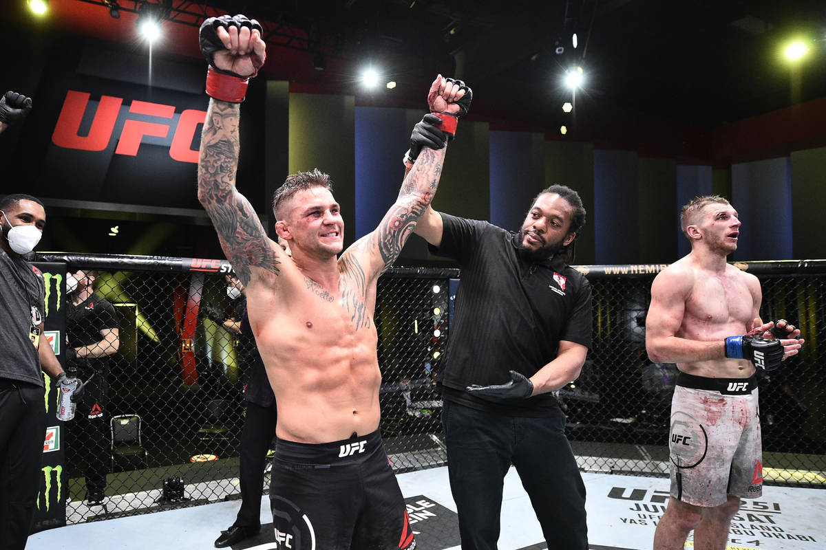 Dustin Poirier celebrates after his victory over Dan Hooker of New Zealand in their lightweight ...