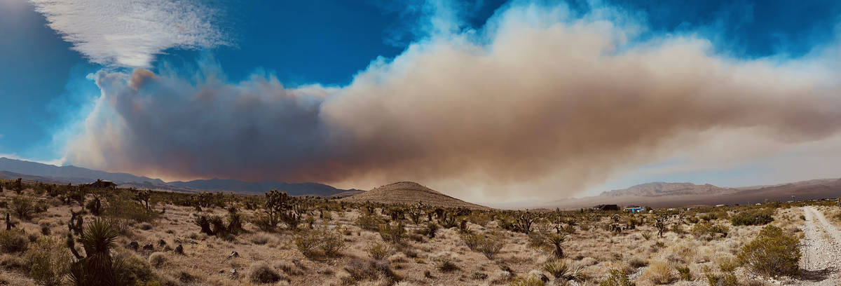 Smoke moves with a fast wind on the way up Kyle Canyon, Sunday, June 28, 2020, in northwest Las ...