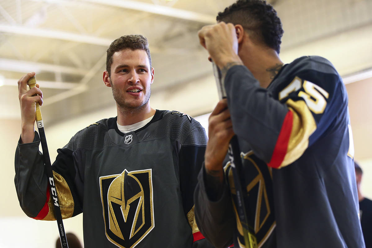 Golden Knights defenseman Brayden McNabb, left, and forward Ryan Reaves participate in a youth ...