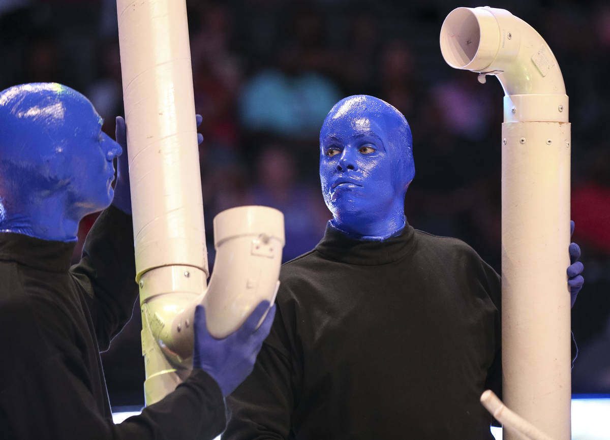 Blue Man Group take part in a half time performance at center-court during the Las Vegas Aces a ...