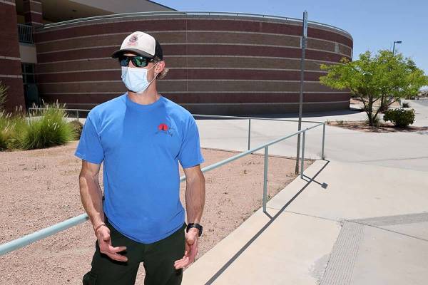 James Norvell of McCall, Idaho, a facilities unit leader trainee and smoke jumper, talks to a r ...