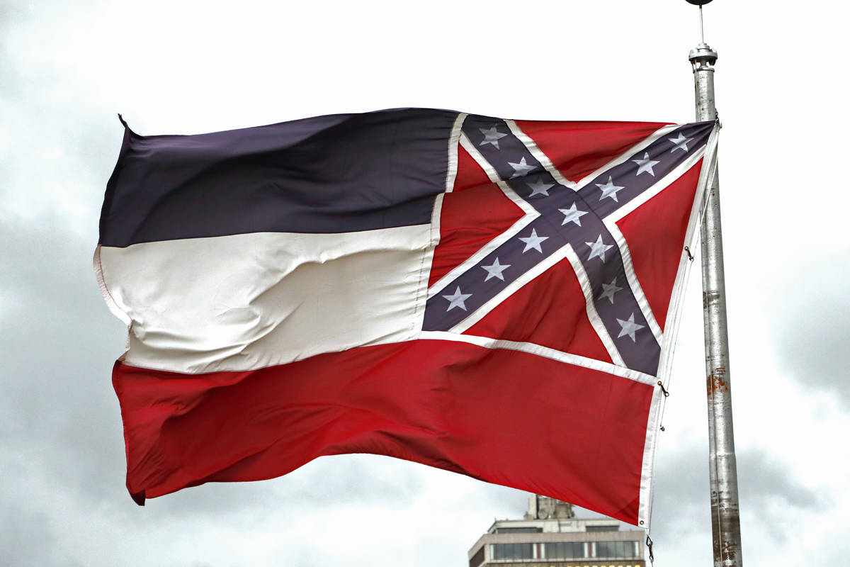 File-This June 25, 2020, file photo shows a Mississippi state flag flying outside the Capitol i ...