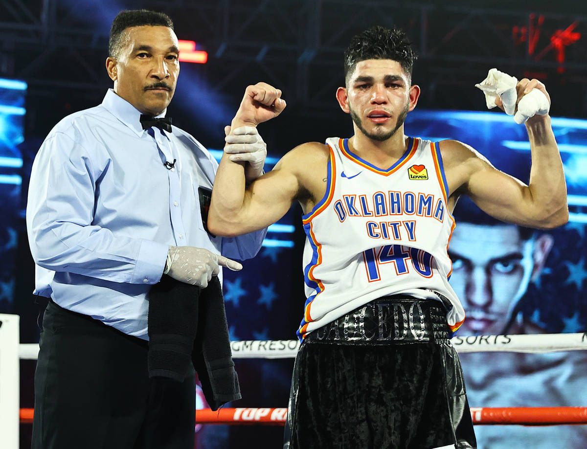 Junior welterweight Alex Saucedo celebrates his victory over Sonny Fredrickson on Tuesday night ...