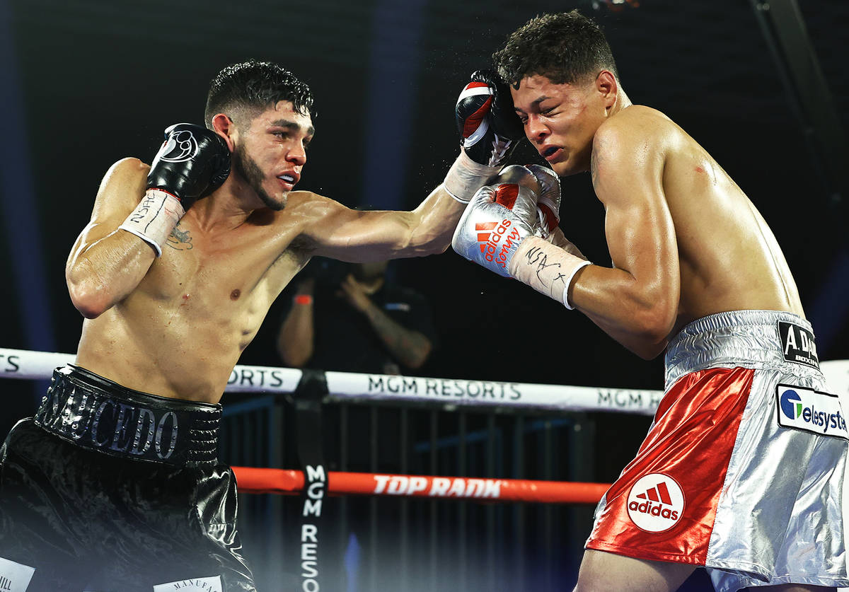 Junior welterweight Alex Saucedo delivers a jab against Sonny Fredrickson on Tuesday night at t ...