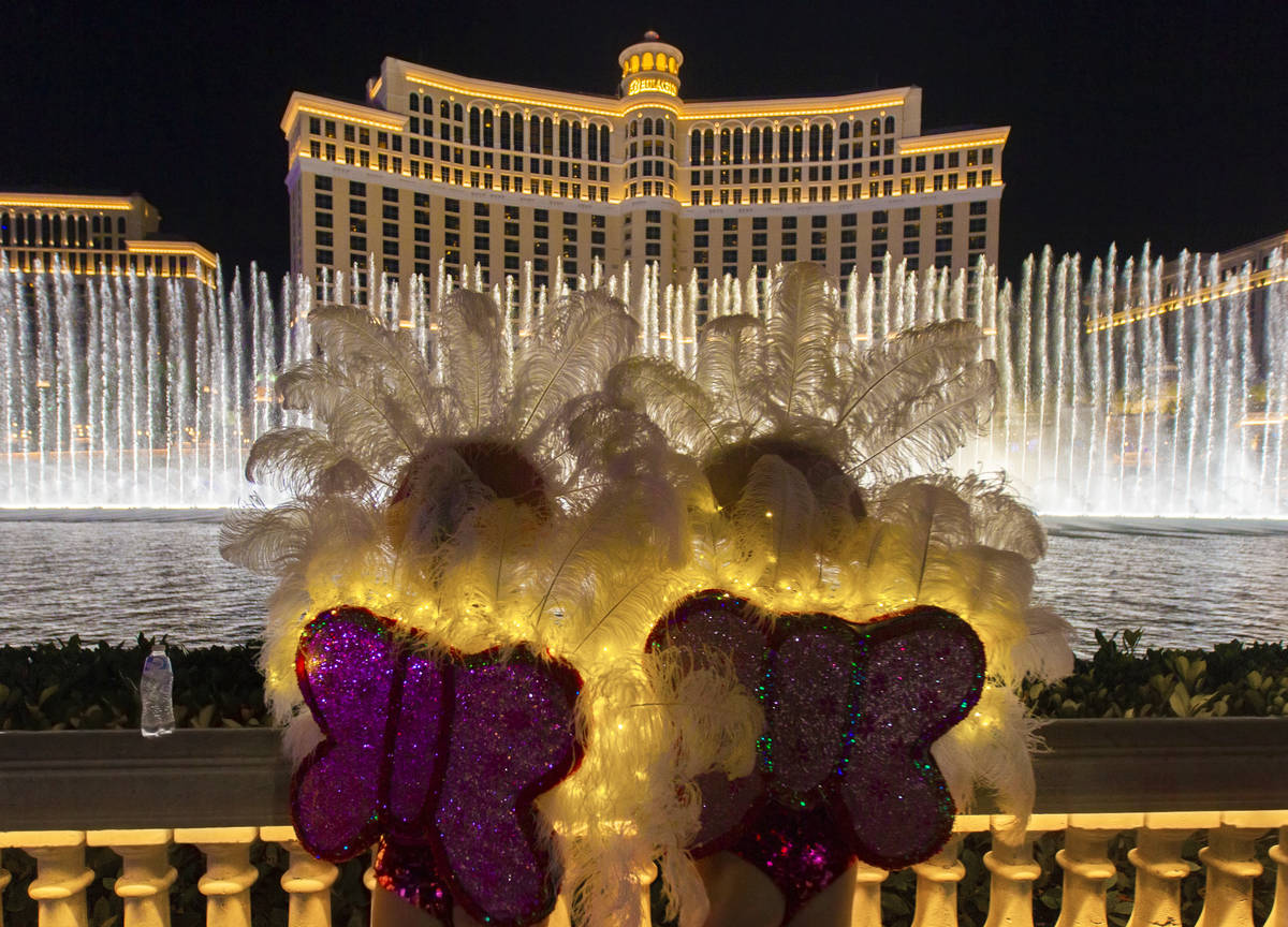 People watch the Fountains of Bellagio on the Strip on Wednesday, July 1, 2020, outside Bellagi ...