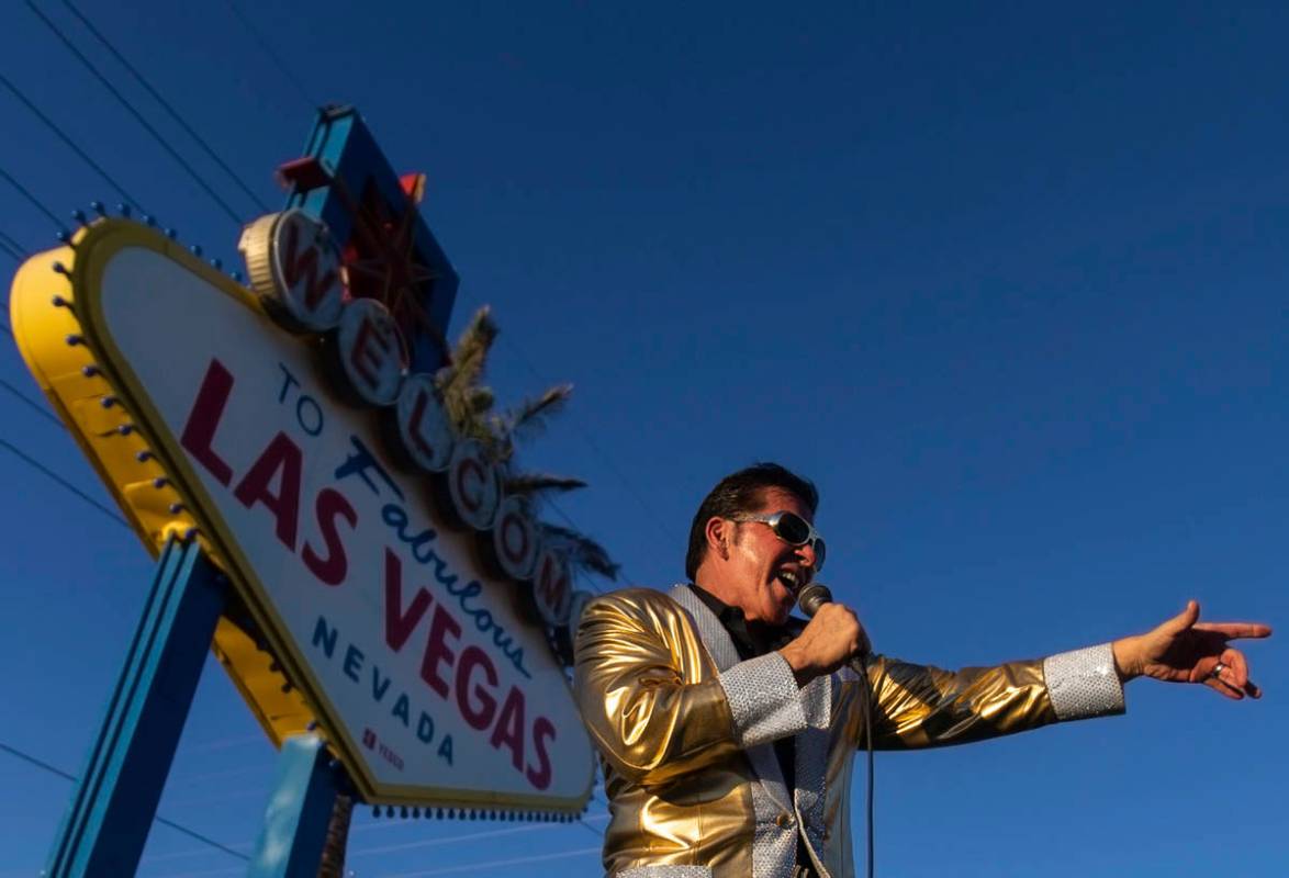 Minster and Elvis impersonator Roland August performs at the Welcome to Fabulous Las Vegas Sign ...