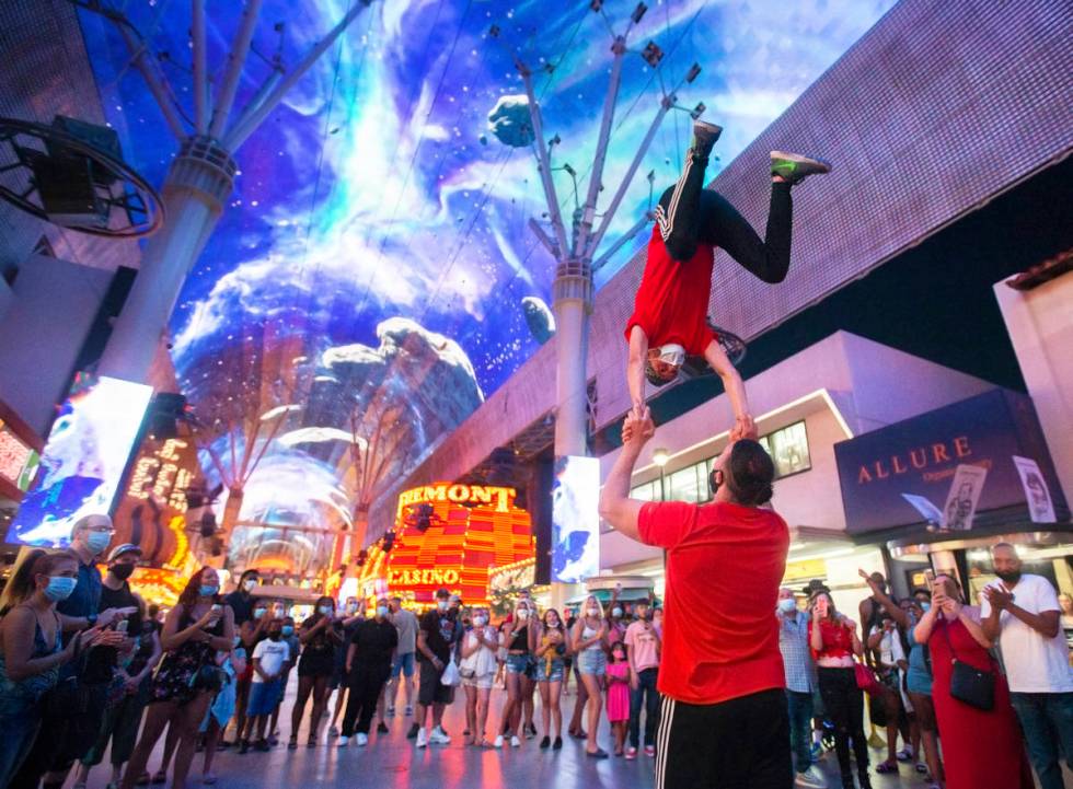 Buskers perform at the Fremont Street Experience on Thursday, July 2, 2020, in Las Vegas. (Benj ...