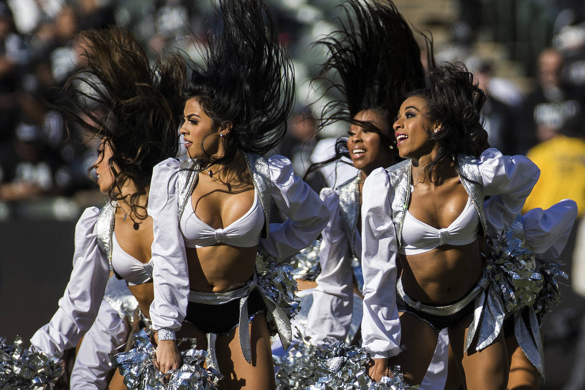 The Raiderettes perform during a break in the first quarter of an NFL football game with the Ja ...