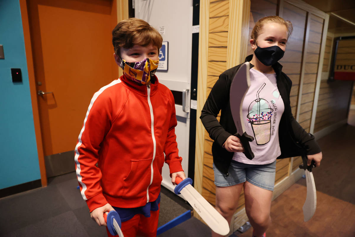 Grant Grover, left, 9, with his sister Emma, 11, play at the Children's Discovery Museum in Las ...