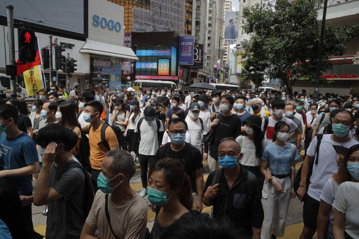 The annual handover march takes place in Causeway Bay, Hong Kong, Wednesday, July. 1, 2020. Hon ...