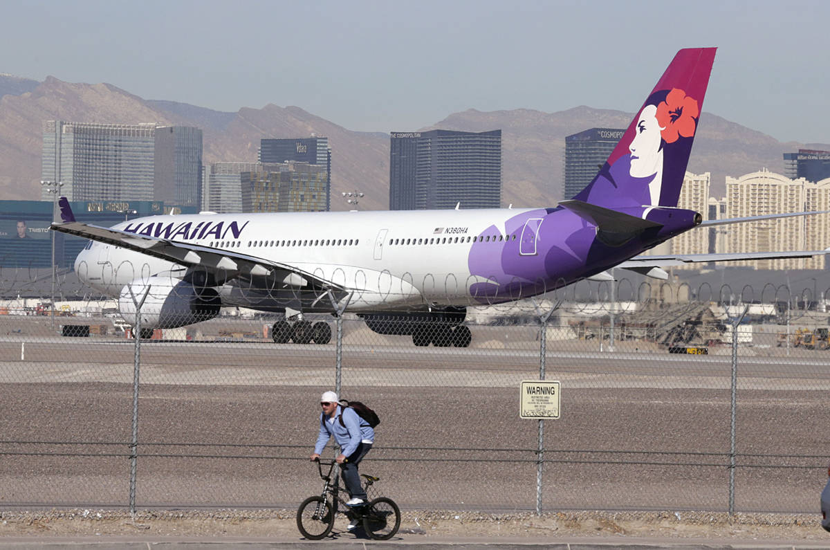 A Hawaiian Airlines plane prepares to take off from McCarran International Airport on Wednesday ...