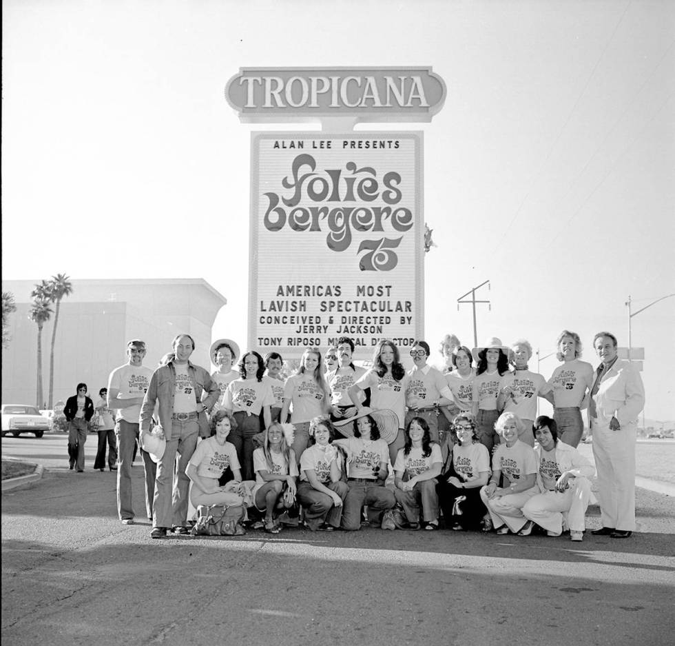 The cast of "Folies Bergere" pose under the marquee of the Tropicana hotel-casino Oct. 17, 1975 ...