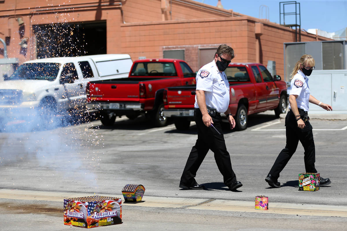 Las Vegas Fire and Rescue's fire inspectors Scott Thompson, left, and Melanie Dennon, give a de ...