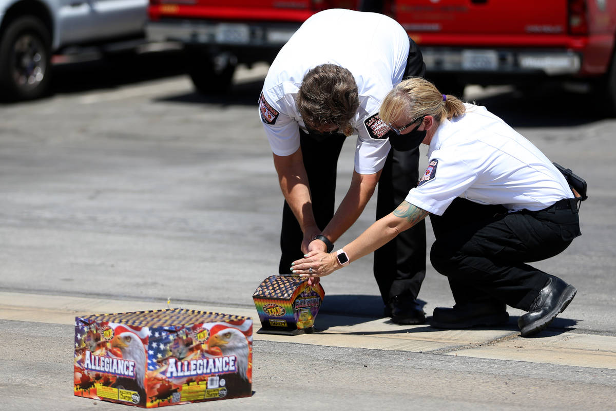 Las Vegas Fire and Rescue's fire inspectors Scott Thompson, left, and Melanie Dennon, give a de ...