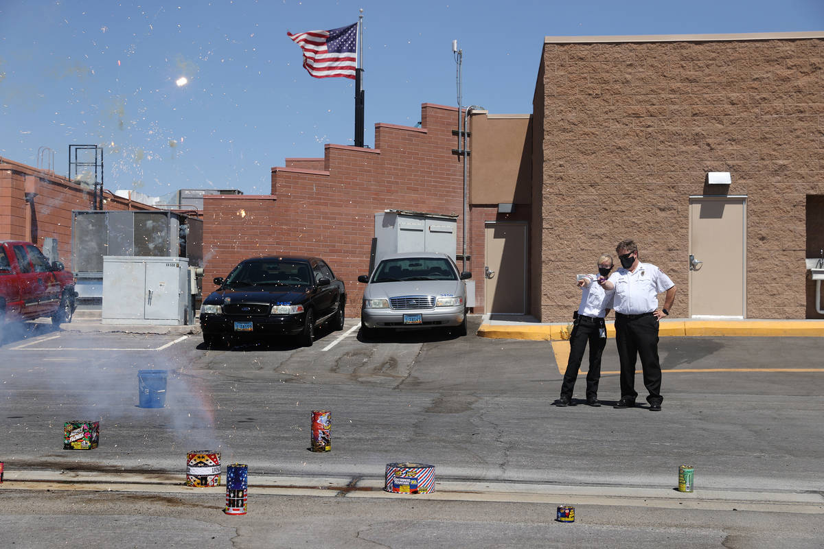 Las Vegas Fire and Rescue's fire inspectors Melanie Dennon, left, and Scott Thompson, give a de ...