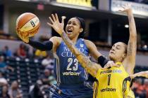FILE - In this Aug. 30, 2017, file photo, Minnesota Lynx's Maya Moore, left, shoots against Ind ...