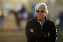 Trainer Bob Baffert watches a morning workout at Churchill Downs Tuesday, May 1, 2018, in Louis ...