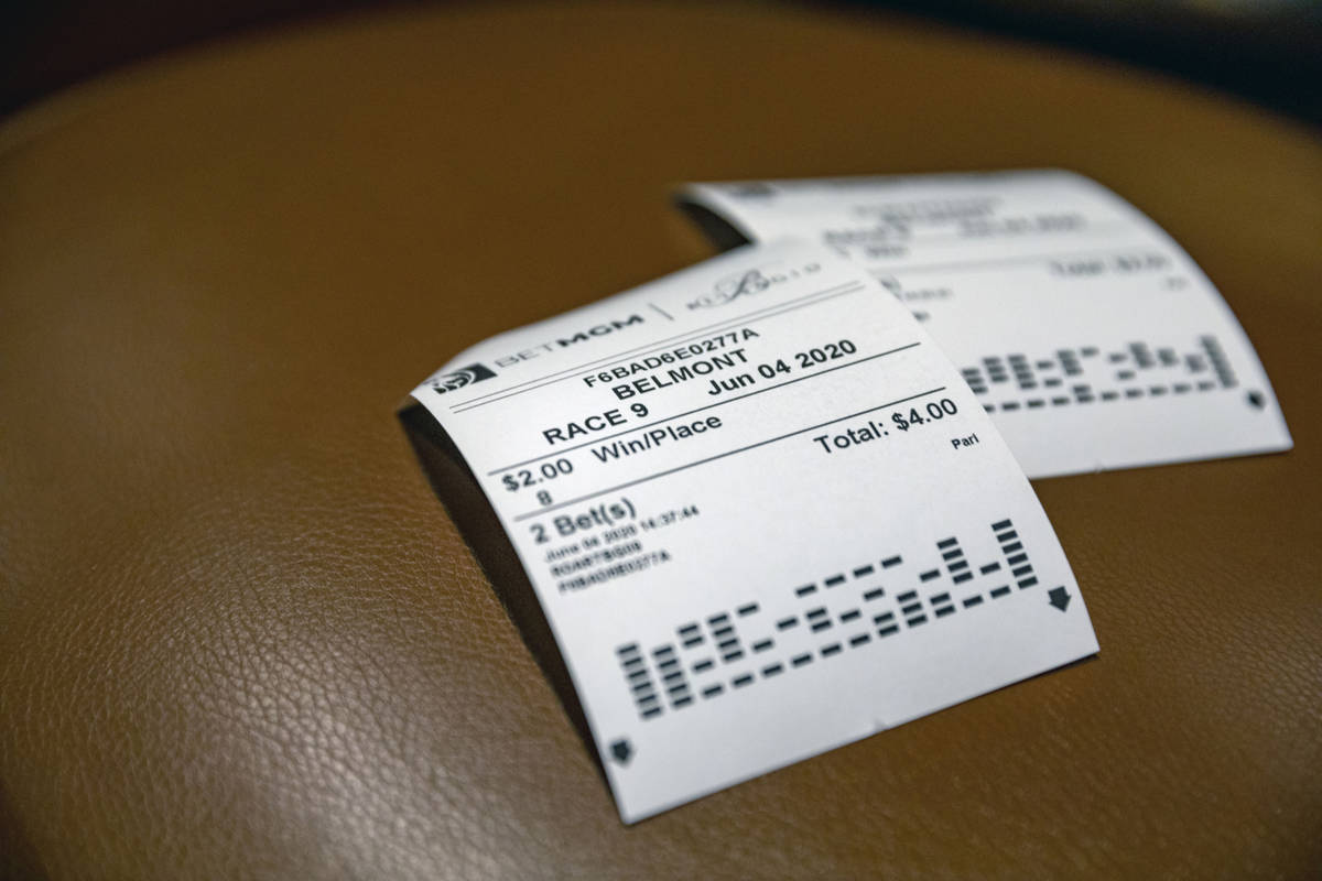 Used betting slips are seen during the reopening of the Bellagio sportsbook, Thursday, June 4, ...