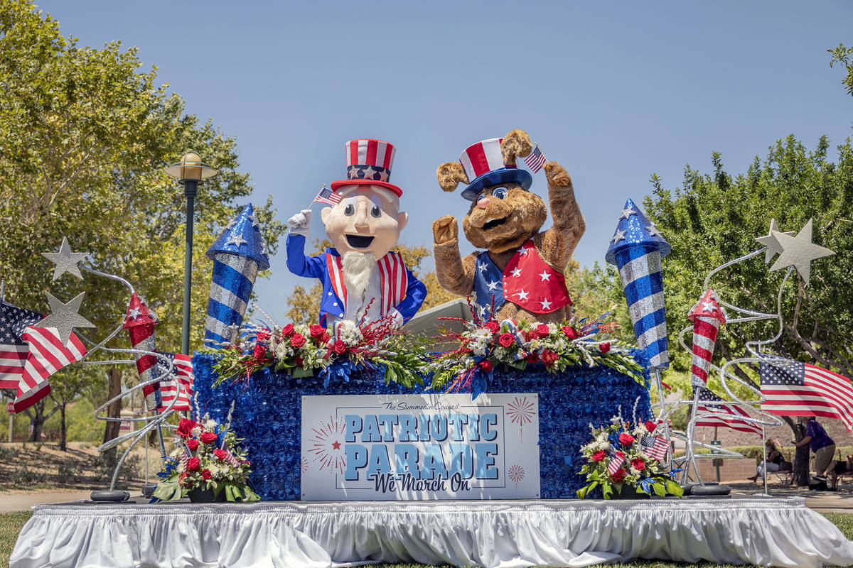Uncle Sam, left, and Summerlin Sam wave from a patriotic broadcast booth during a preview of th ...