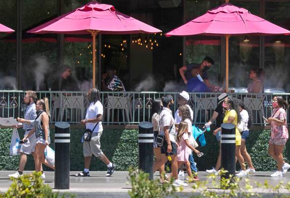 Tourists walk along Las Vegas Boulevard on Friday, July 3, 2020, in Las Vegas. (Bizuayehu Tesfa ...
