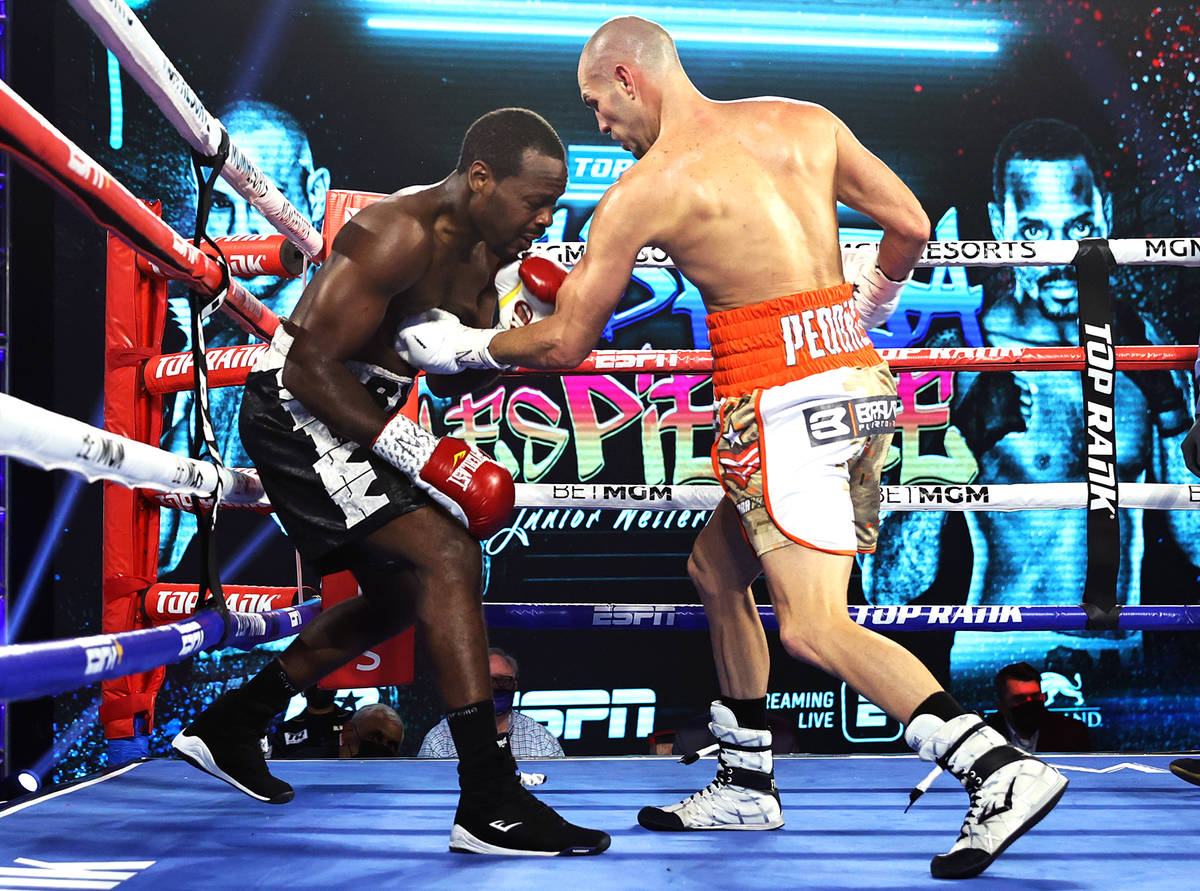 Jose Pedraza punches Mikkel LesPierre during their junior lightweight fight Thursday night at t ...