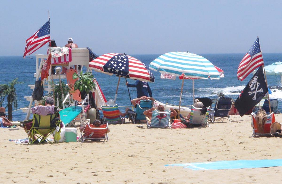 Flags line the beach in Belmar, N.J., on June 28, 2020. With large crowds expected at the Jerse ...