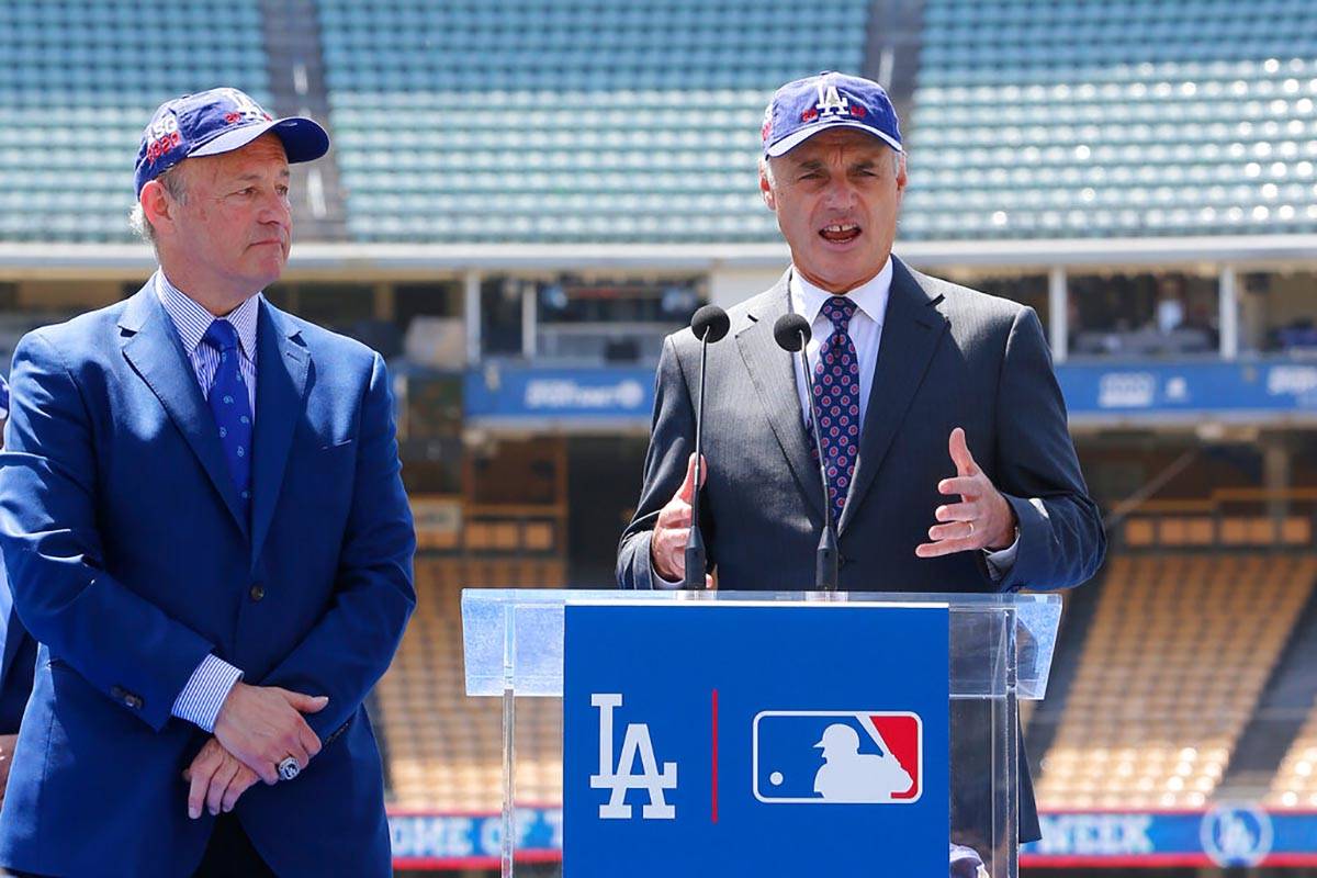 FILE - In this April 11, 2018, file photo, Los Angeles President and CEO Stan Kasten, left, and ...