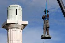 A monument of Robert E. Lee, who was a general in the Confederate Army, is removed in New Orlea ...