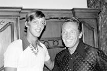 Ray Guy, left, of Thomson, Ga., and graduate of the University of Southern Mississippi, poses w ...