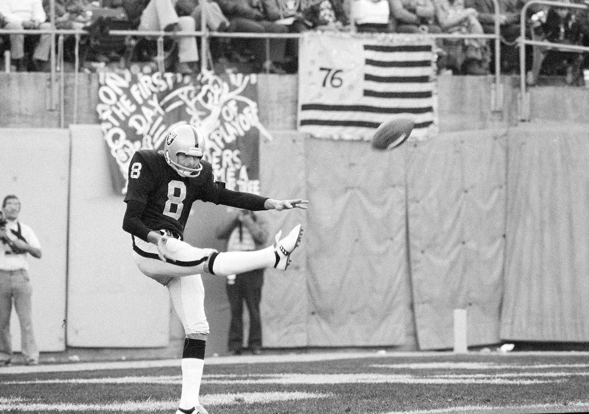 Ray Guy (8), Oakland Raiders punting specialist, booms one in a recent game in 1976. (AP Photo)