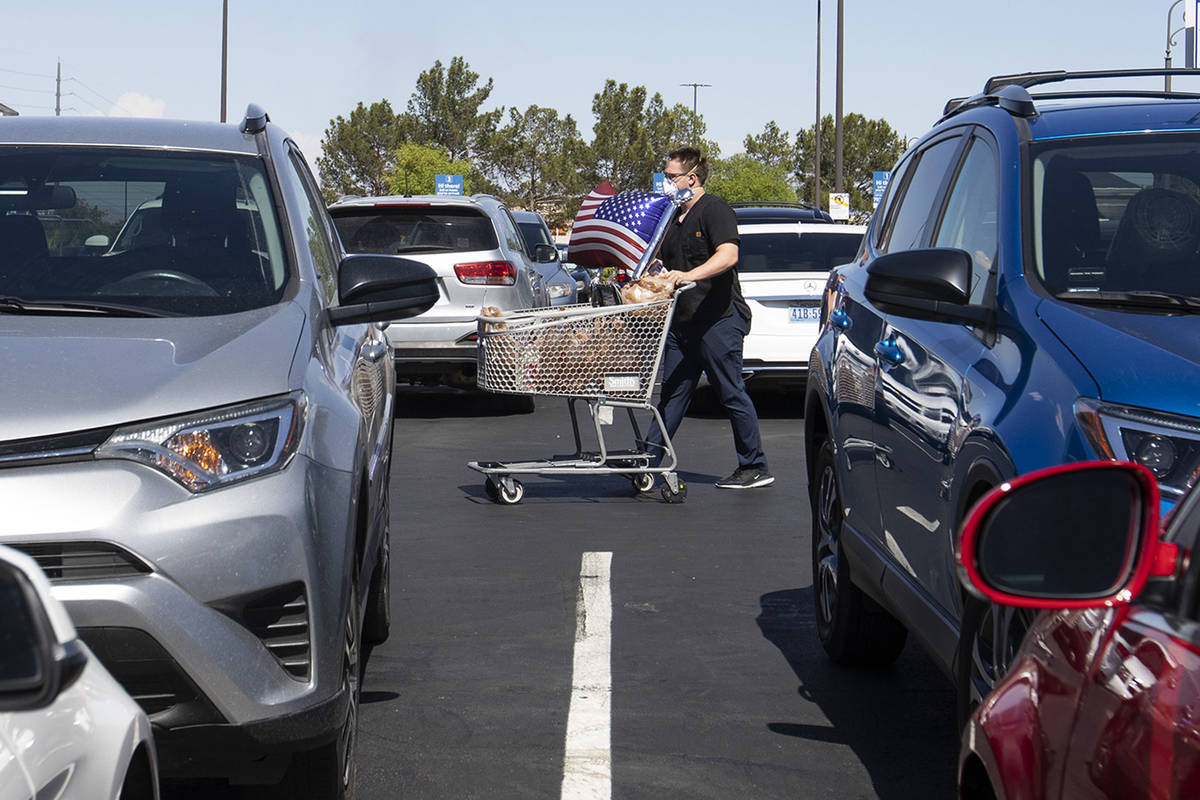 Mason Stanley walks to his car in the parking lot of the Smith's Food & Drug on West Charle ...