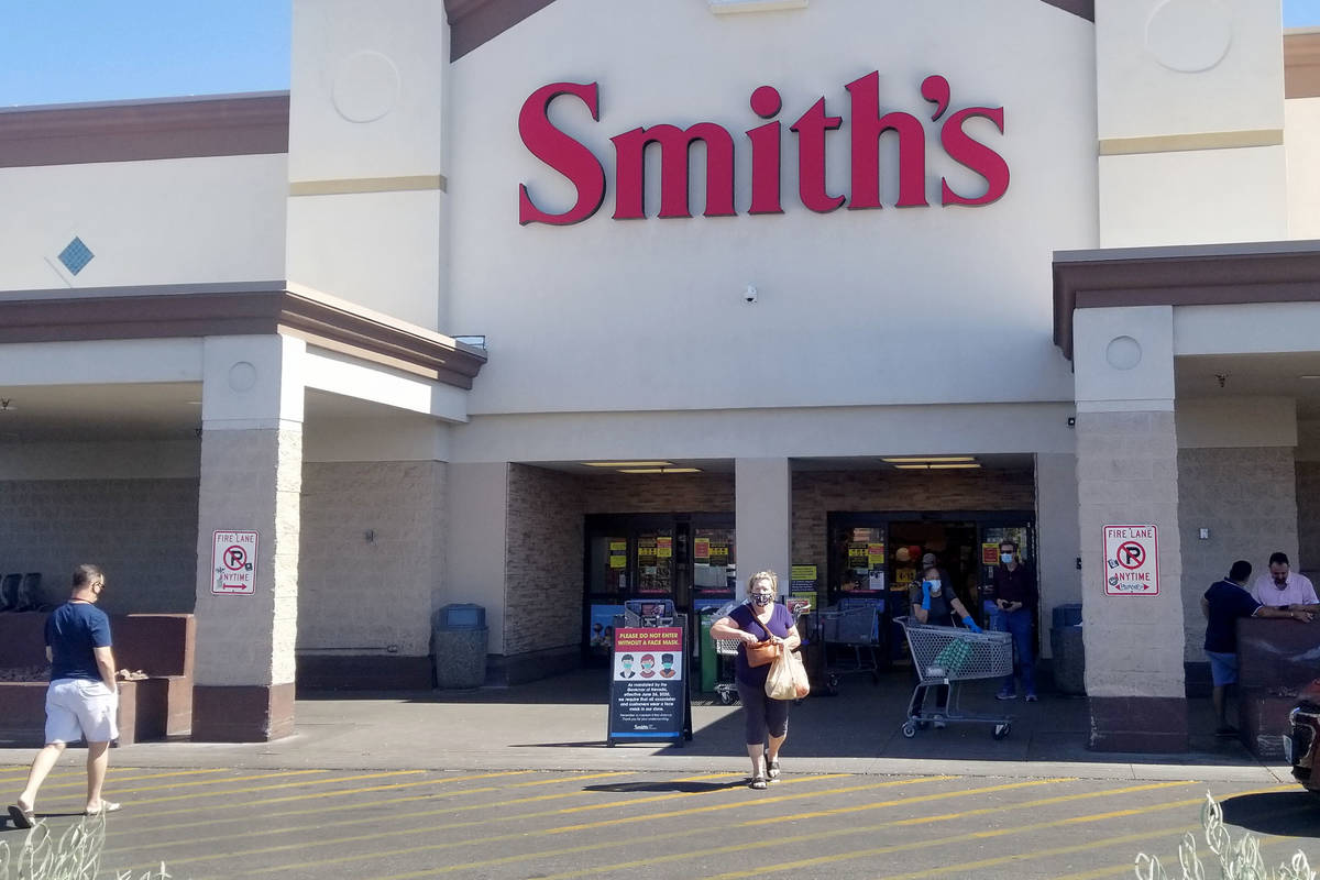 Customers enter and exit the Smith's at 8555 West Sahara Ave. in Las Vegas, Friday, July 3, 202 ...
