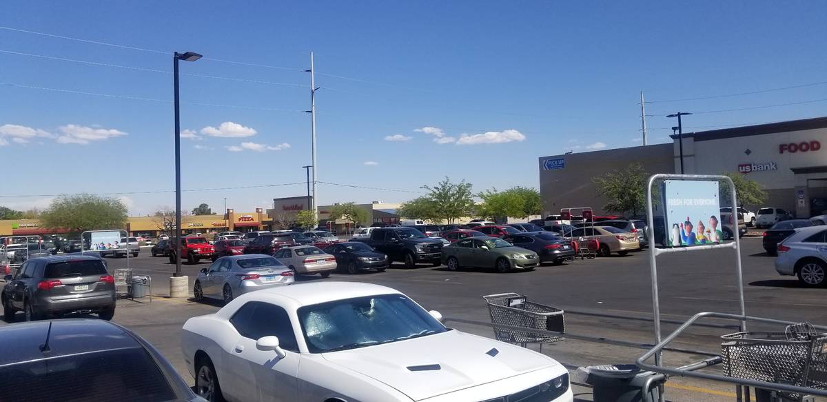 The parking lot of the Smith's is packed at 8555 West Sahara Ave. in Las Vegas, Friday, July 3, ...
