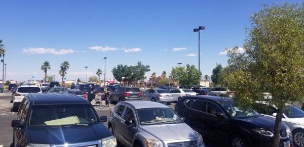 The parking lot of the Vons is packed at 8540 West Desert Inn Road in Las Vegas, Friday, July ...