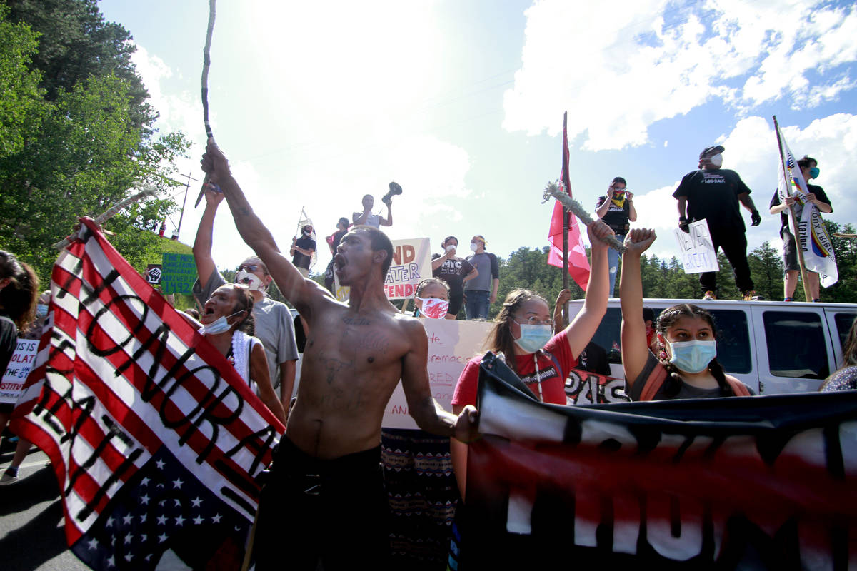 Native American protesters form a roadblock on the road leading to Mount Rushmore ahead of Pres ...