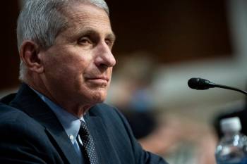 Director of the National Institute of Allergy and Infectious Diseases Dr. Anthony Fauci listens ...