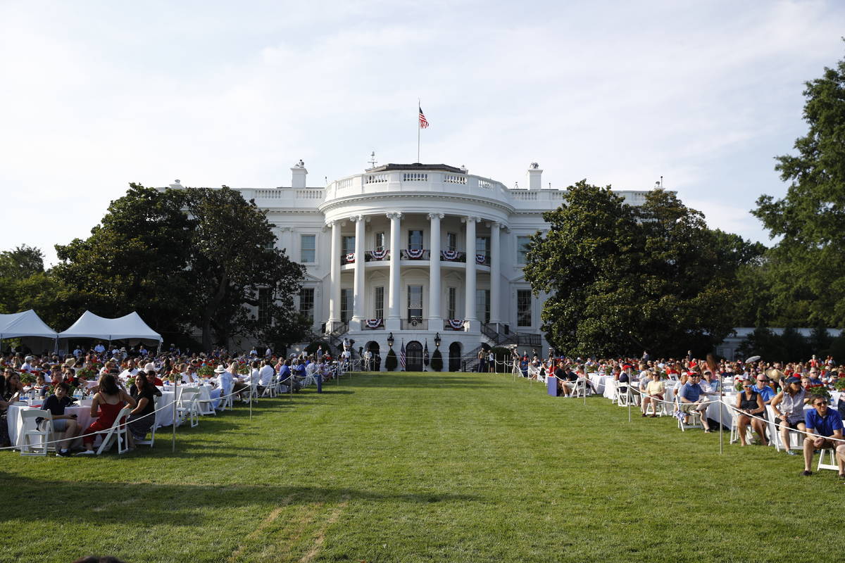 Guests wait for President Donald Trump and first lady Melania Trump during a "Salute to Am ...