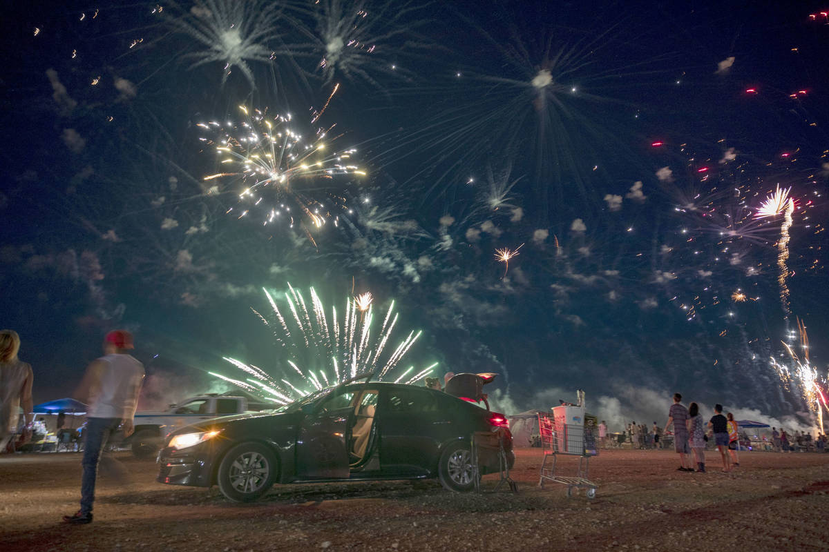 Fireworks explode near Moapa Paiute Travel Plaza during Fourth of July festivities in Moapa, Ne ...