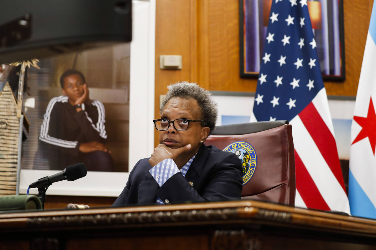 Mayor Lori Lightfoot conducts a virtual City Council meeting from her office at City Hall on We ...